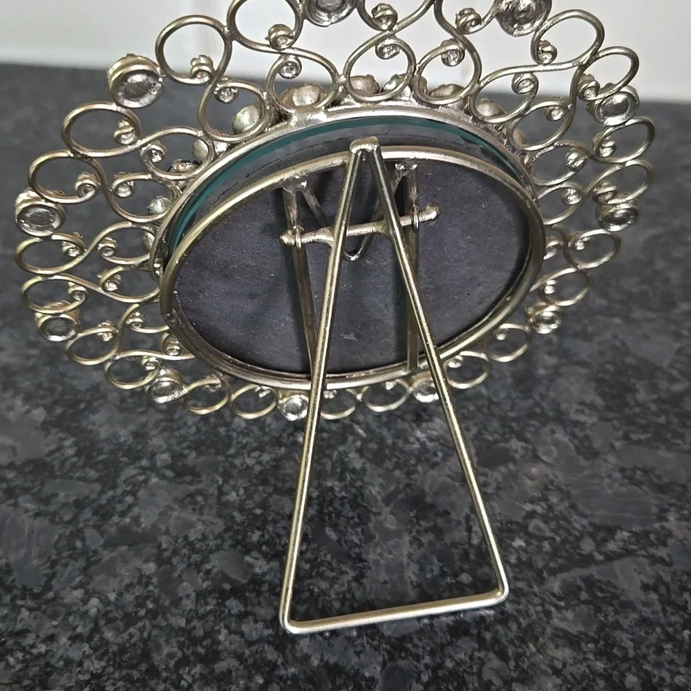 Gold Metal Round Frame Bedazzled with Blue Gem Stones